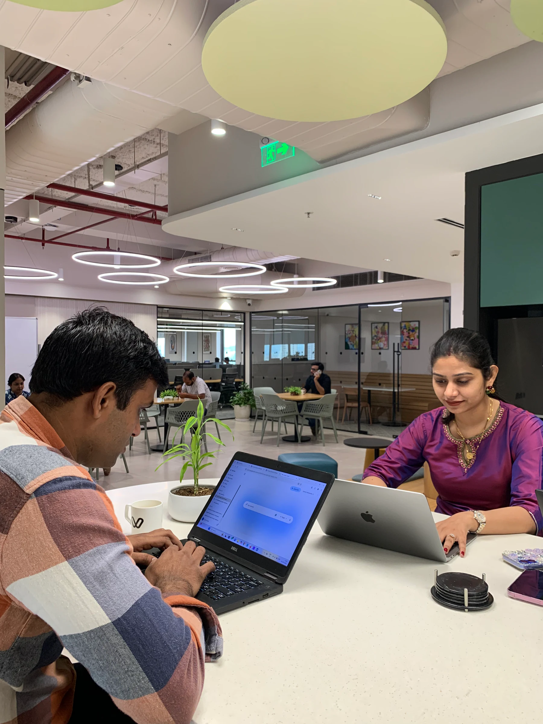 Vinove colleagues having a focused work conversation